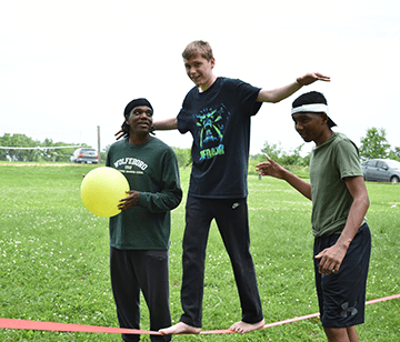 Test your balance skills by participating in slacklining! Whether campers have tried it before or are completely new to the activity, it's a popular event for all. If you're scared to fall, don't worry. You can have spotters on either side of you for support as you navigate the line only two feet off the ground. Or, if you're more daring, try walking the line all by yourself!