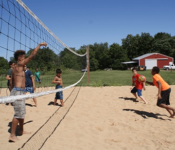 Our beach volleyball court allows volleyball lovers to play a rousing game of 2 on 2 up through full 6 on 6 games. As with all of our team sports activities, we emphasize sportsmanship, effort, maintaining a positive attitude, developing skills and teamwork, and learning the rules of the game.